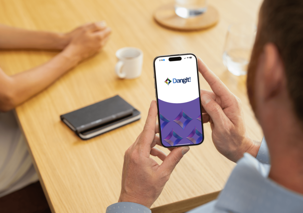 Person holding a phone on the app Dangit!